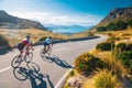 Road cycling photo. Two triathlete train in beautiful nature. Sea and mountains in background. Alcudia, Mallorca, Spain