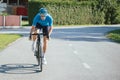 Road cycling racer taking a body position for the sprint on a bike