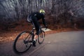 road cyclist in a snowy forest Royalty Free Stock Photo