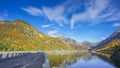 The road on the dam of Baserca Reservoire during autumn , Spain