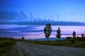 Road in the dawn against the blue sky in Turkey. Sunrise, field, mountains, trees in the morning in Cappadocia. Royalty Free Stock Photo