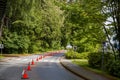 Road with demarcating cones, road signs, repair and construction. Royalty Free Stock Photo