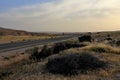 A road through the desert in the morning hours