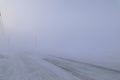 Road disappearing under blizzard conditions Royalty Free Stock Photo