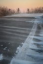 Road disappearing under blizzard conditions. Royalty Free Stock Photo
