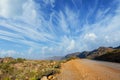 Road down the mountain, big beautiful skies