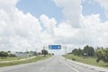 Road with the entrance sign to Fray Bentos, in the Oriental Republic of Uruguay