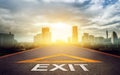 Road with Exit sign leading to hope and light in modern City , pathway to solution and freedom concept