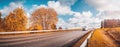 Road at falls on sunny day. Highway in autumn Royalty Free Stock Photo