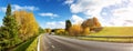 Road at falls on sunny day. Highway in autumn Royalty Free Stock Photo