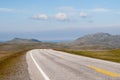 The road is far away against the background of stony hills Royalty Free Stock Photo