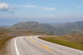 The road is far away against the background of stony hills Royalty Free Stock Photo
