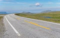 The road is far away against the background of stony hills Royalty Free Stock Photo