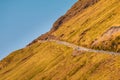 The road is fenced on a steep mountain slope. Tjornuvik, Faroe Islands, Denmark