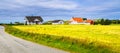 Road, field and rural house on the coast of ocean. Norway. Count