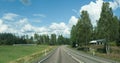 Road in Finland. blue sky and white clouds