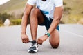 Road, fitness and hands of man with shoes tie for running, training or race preparation outdoor zoom. Legs, runner and Royalty Free Stock Photo