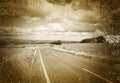 Road and flat landscape in sepia Royalty Free Stock Photo