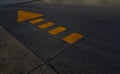 Road floor with yellow lines and arrow sign Royalty Free Stock Photo