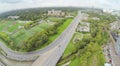 Road and with football fields at cloudy day. View Royalty Free Stock Photo