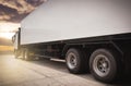 Road freight cargo by truck. Shipment, Delivery service. Semi truck on parking at sunset sky. Logistics and transportation. Royalty Free Stock Photo