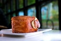 road french pastry breakfast round american croissant with vanilla and walnut dessert bread scrolls on a plate by hand