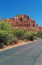 Road in front of red orange rock formations in Sedona, AZ Royalty Free Stock Photo