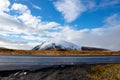 road in front of small snow covered mountain Royalty Free Stock Photo