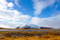 road in front of small snow covered mountain Royalty Free Stock Photo