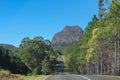 A road through the Glass Mountains of Queensland Australia that looks like it is headed straight toward a looming ancient volcanic