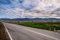 The road goes into the distance. Beautiful landscape. Blue sky with white clouds over the mountain valley. Chuisky tract Royalty Free Stock Photo