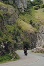 Road going through Cheddar Gorge, Somerset, UK, biker riding through, motion blur