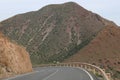 Road going through rocky mountains