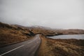 Road going through Scottish Highlands near Lochinver. Royalty Free Stock Photo