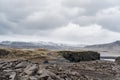 The road going to the horizon, snow-capped rocky mountains. Near Black Beach Vik, Iceland. Royalty Free Stock Photo
