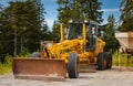 Road grader - heavy earth moving dirt. Grader Road Construction Grader industrial machine on construction of new roads Royalty Free Stock Photo