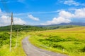 Road and Green grass with blue sky at Klong Haeng Reservoir Krabi