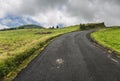 Road through green hills landscape on Sao Miguel island, Portugal