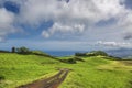 Road through green hills landscape on Sao Miguel island, Portugal