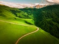 Road in the green mountains at sunset. Aktoprak Pass in North Caucasus, Russia