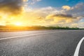 Road and green woods background at sunset Royalty Free Stock Photo