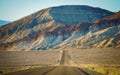 Road heading toward painted rocks Royalty Free Stock Photo