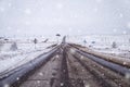 Road during heavy snowstorm blizzard in winter. Dangerous driving conditions Royalty Free Stock Photo