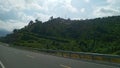 Road highway infrastructure sky cloud mountain hill tree land driving horizon landcape nature land Royalty Free Stock Photo