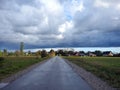 Road, homes and beautiful cloudy sky, Lithuania