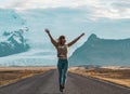 Road on Iceland, glacier, blond woman running Royalty Free Stock Photo