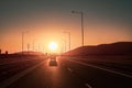 Road, infrastructure, transportation during sunset near a city, without smog, with amazing light and cars Royalty Free Stock Photo