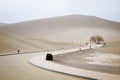 The road inside Mingsha shan desert and Crescent moon lake in Du Royalty Free Stock Photo