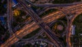 Road interchange in the city at night with vehicle car light movement, Aerial view Royalty Free Stock Photo