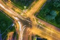 Road intersection with car traffic at night city. aerial photo Royalty Free Stock Photo